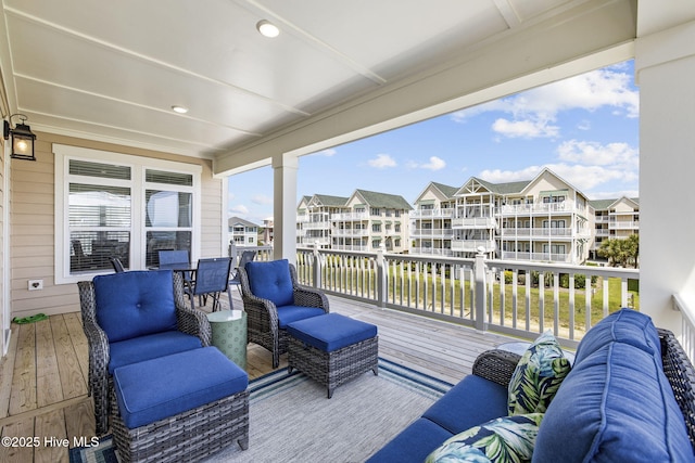 wooden deck featuring an outdoor hangout area