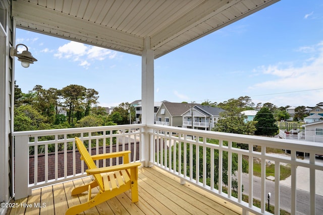 wooden terrace with a residential view