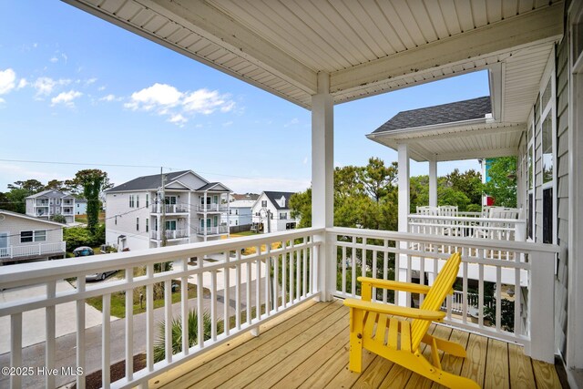 wooden terrace featuring a residential view