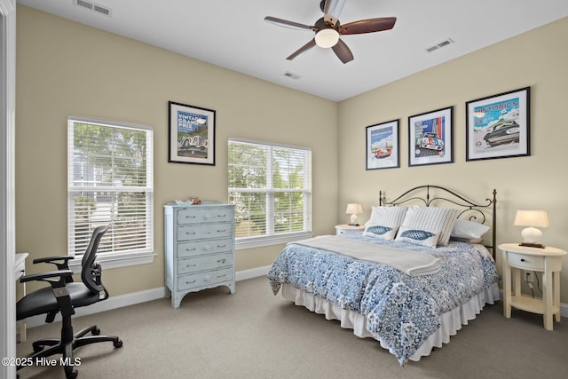 bedroom with visible vents, carpet flooring, and baseboards
