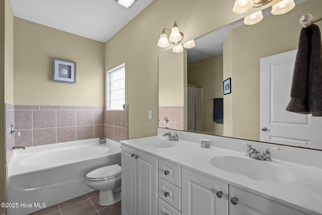 bathroom featuring double vanity, tile patterned flooring, a bath, and a sink