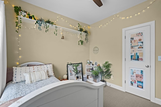 bedroom featuring ceiling fan, carpet flooring, and baseboards