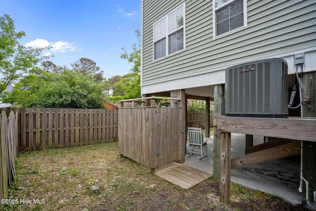 view of yard featuring a fenced backyard and central AC unit