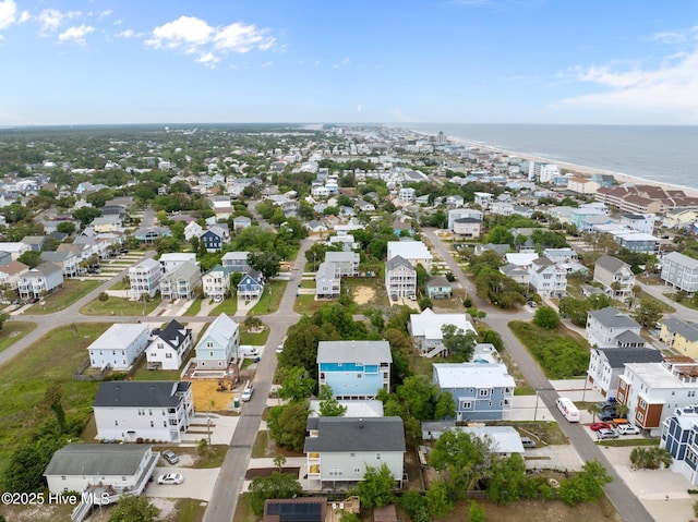 drone / aerial view featuring a water view and a residential view