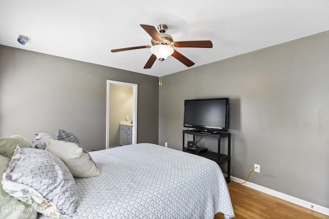 8602 Heirloom Dr NE, Leland, NC 28451 - bedroom with light wood finished floors, a ceiling fan, and baseboards