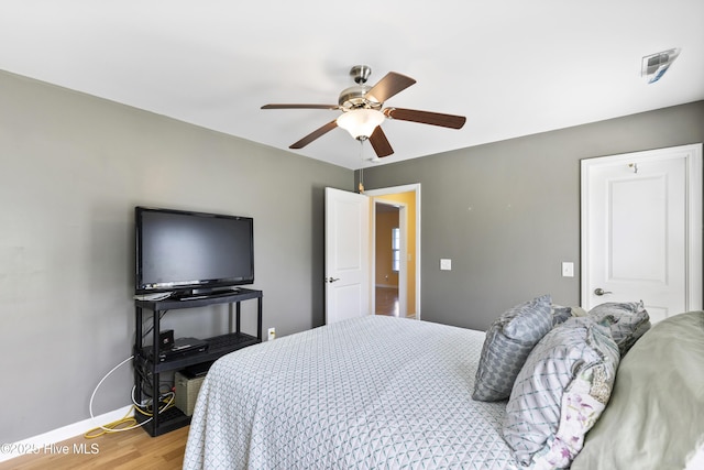 8602 Heirloom Dr NE, Leland, NC 28451 - bedroom with a ceiling fan, visible vents, wood finished floors, and baseboards