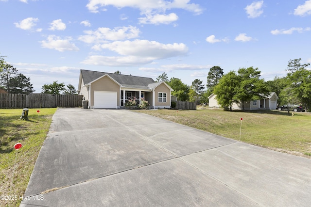 8602 Heirloom Dr NE, Leland, NC 28451 - ranch-style home featuring driveway, fence, a front yard, and a garage
