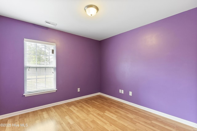 8602 Heirloom Dr NE, Leland, NC 28451 - empty room with baseboards, visible vents, and light wood finished floors