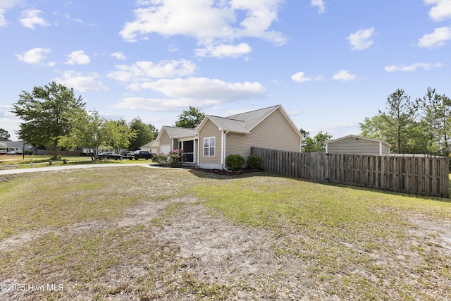 8602 Heirloom Dr NE, Leland, NC 28451 - view of front facade featuring fence and a front yard