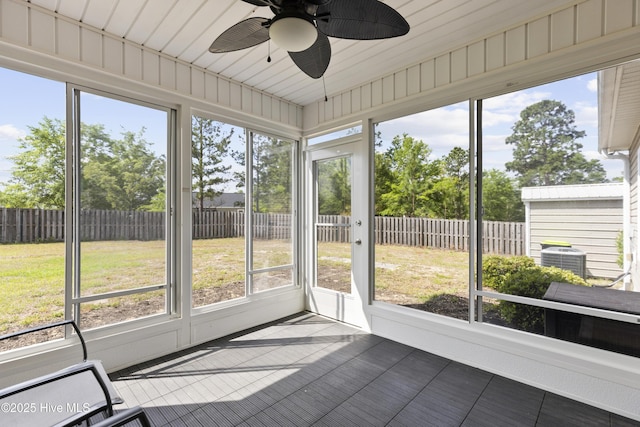 8602 Heirloom Dr NE, Leland, NC 28451 - unfurnished sunroom with a ceiling fan and a healthy amount of sunlight