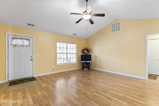 8602 Heirloom Dr NE, Leland, NC 28451 - entryway with visible vents, light wood-type flooring, and vaulted ceiling