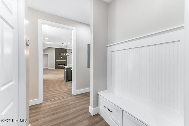 1104 Soundside Rd, Edenton, NC 27932 - mudroom with a fireplace, light wood-style flooring, baseboards, and recessed lighting