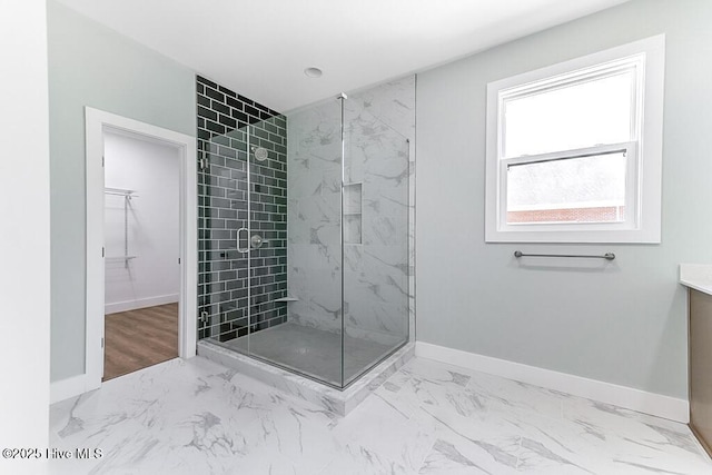1104 Soundside Rd, Edenton, NC 27932 - full bath featuring baseboards, a shower stall, marble finish floor, vanity, and a spacious closet