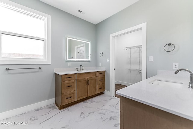 1104 Soundside Rd, Edenton, NC 27932 - bathroom with baseboards, marble finish floor, vanity, and visible vents
