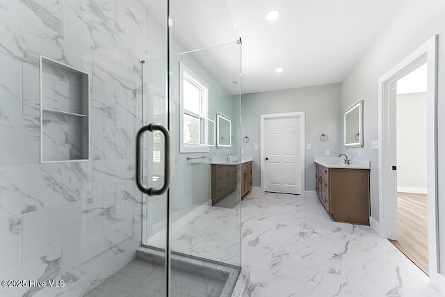 1104 Soundside Rd, Edenton, NC 27932 - bathroom with a marble finish shower, marble finish floor, and two vanities