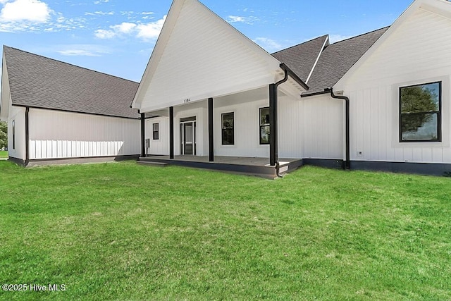 1104 Soundside Rd, Edenton, NC 27932 - back of property with a yard, covered porch, and a shingled roof