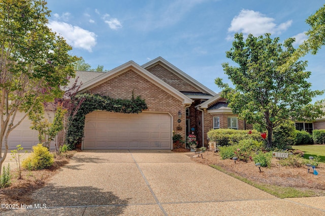 1105 Avebury Ct, Leland, NC 28479 - view of front of property featuring brick siding, a garage, and concrete driveway
