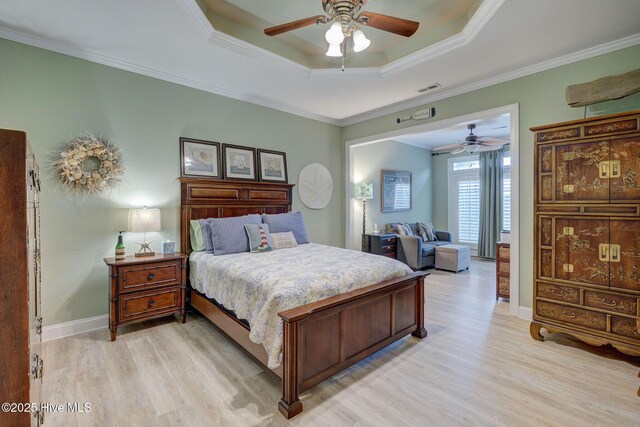 1105 Avebury Ct, Leland, NC 28479 - bedroom with light wood-type flooring, a raised ceiling, crown molding, and visible vents