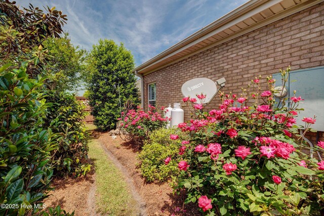 1105 Avebury Ct, Leland, NC 28479 - view of side of home featuring brick siding and fence