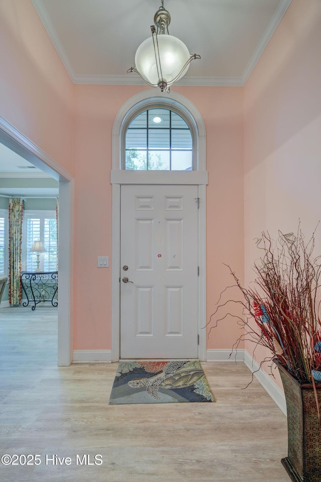 1105 Avebury Ct, Leland, NC 28479 - entryway featuring crown molding, baseboards, and light wood-style floors