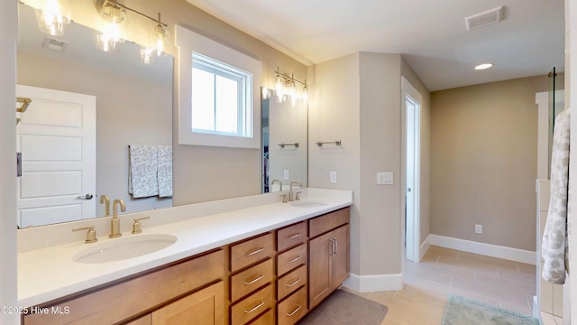 full bathroom featuring a sink, double vanity, baseboards, and visible vents