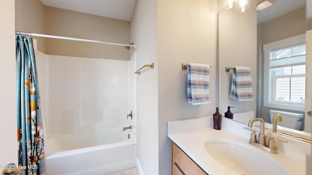 bathroom featuring shower / bath combo and vanity