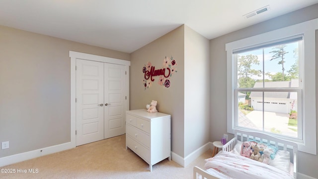 living area featuring visible vents, baseboards, and light carpet