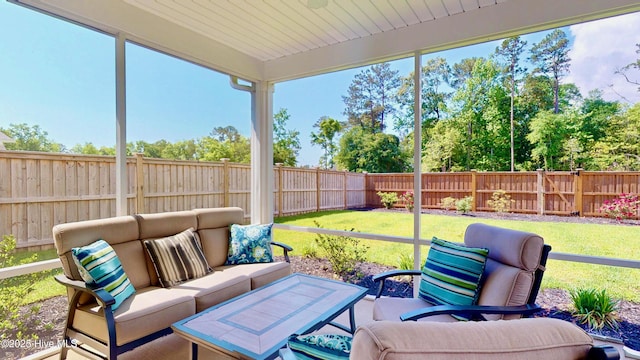 sunroom with an outdoor living space and plenty of natural light