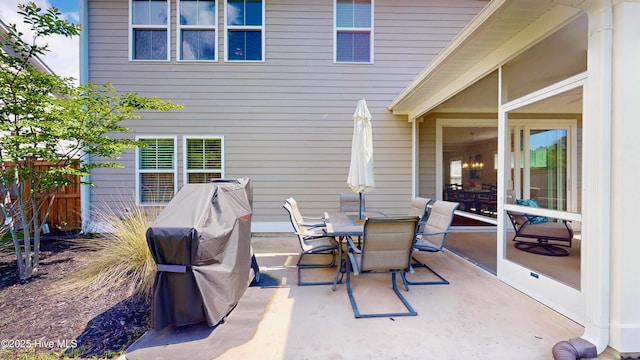 view of patio / terrace with outdoor dining space, area for grilling, and fence