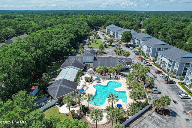 473 White Heron Ct SW, Sunset Beach, NC 28468 - bird's eye view featuring a forest view
