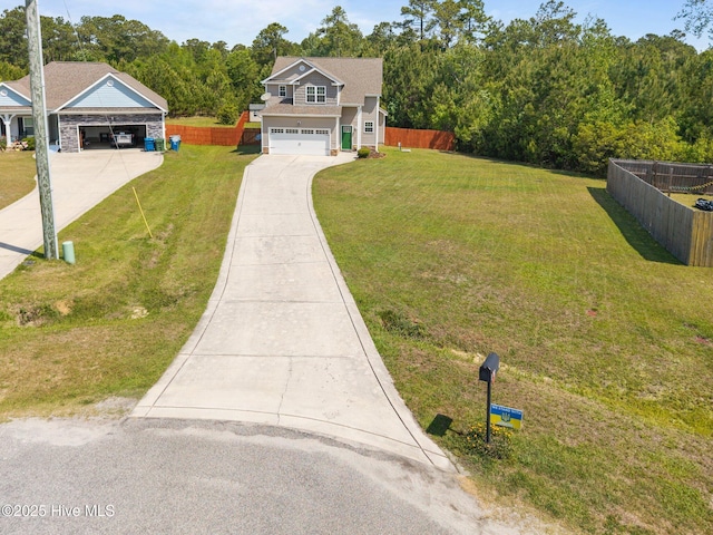 110 Costa Ct, Sneads Ferry, NC 28460 - view of front of house featuring concrete driveway, a garage, and a forest view