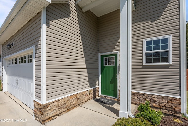 110 Costa Ct, Sneads Ferry, NC 28460 - entrance to property featuring stone siding and a garage