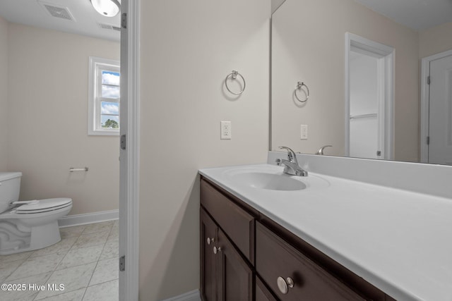 110 Costa Ct, Sneads Ferry, NC 28460 - bathroom with baseboards, vanity, and toilet