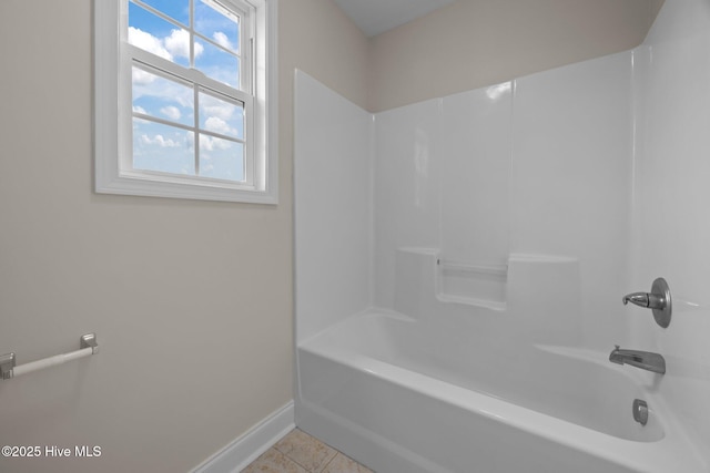 110 Costa Ct, Sneads Ferry, NC 28460 - bathroom featuring baseboards, tile patterned flooring, and bathing tub / shower combination