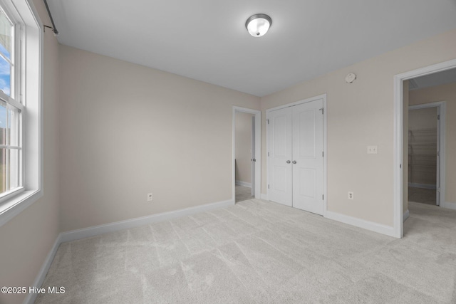 110 Costa Ct, Sneads Ferry, NC 28460 - unfurnished bedroom featuring carpet flooring, baseboards, and a closet