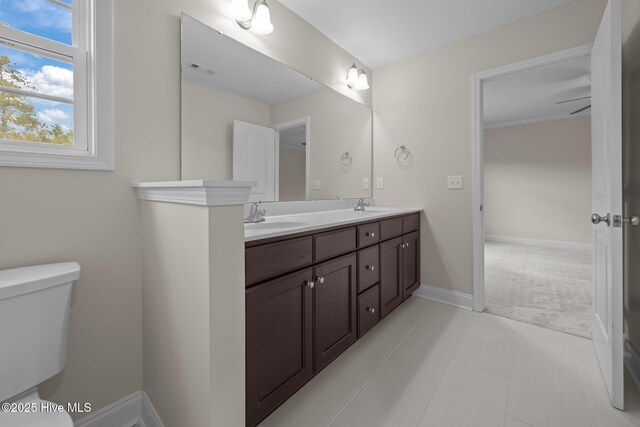 110 Costa Ct, Sneads Ferry, NC 28460 - full bathroom with double vanity, toilet, and baseboards