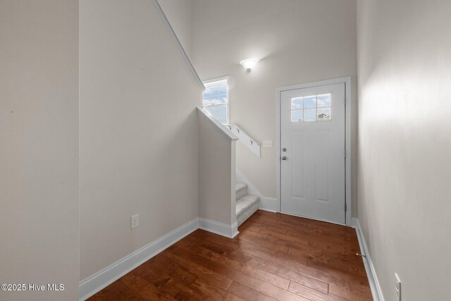 110 Costa Ct, Sneads Ferry, NC 28460 - entrance foyer featuring wood finished floors, baseboards, and stairs