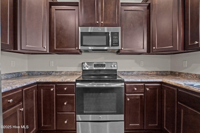 110 Costa Ct, Sneads Ferry, NC 28460 - kitchen with appliances with stainless steel finishes and dark brown cabinetry