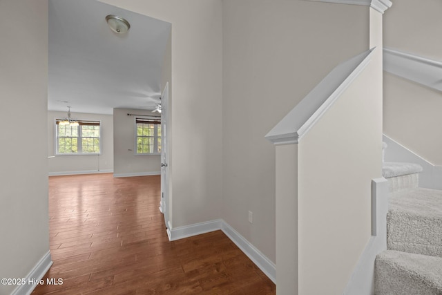 110 Costa Ct, Sneads Ferry, NC 28460 - stairs with wood finished floors, baseboards, ceiling fan, and a chandelier