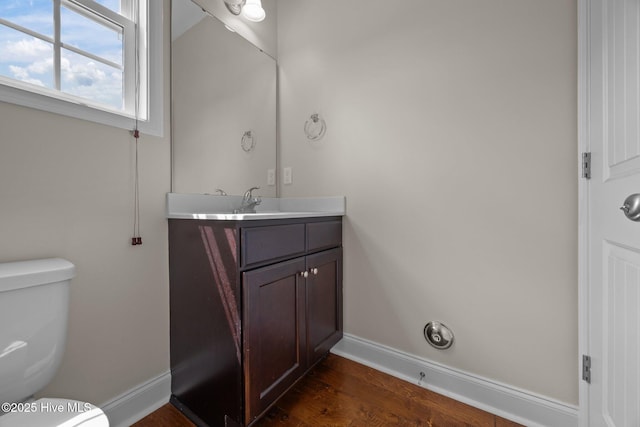 110 Costa Ct, Sneads Ferry, NC 28460 - half bathroom with baseboards, toilet, vanity, and wood finished floors