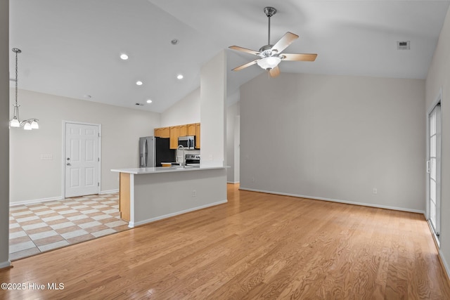 unfurnished living room with a ceiling fan, high vaulted ceiling, light wood-style floors, baseboards, and recessed lighting