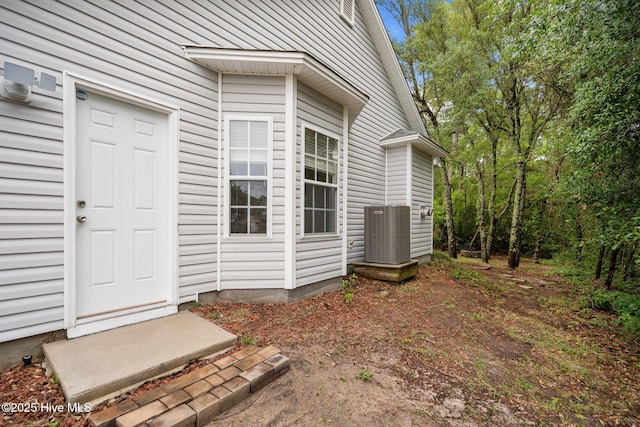 property entrance with central AC unit