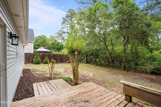 wooden deck featuring fence