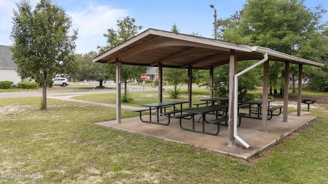 view of property's community with a gazebo and a yard