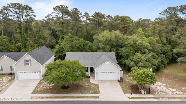 view of subject property featuring a forest