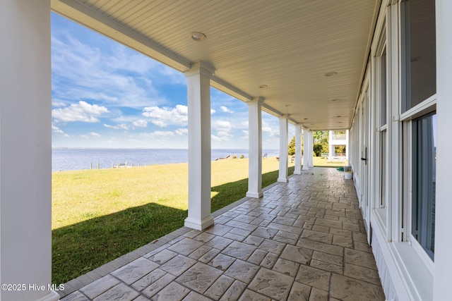 view of patio with a water view