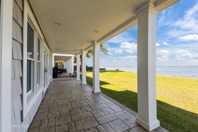 view of patio / terrace with a water view