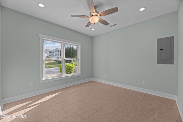 spare room featuring electric panel, a ceiling fan, recessed lighting, and visible vents