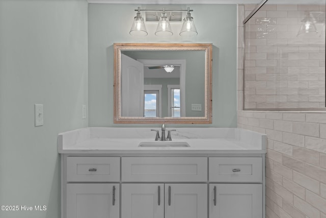 bathroom with vanity and a ceiling fan