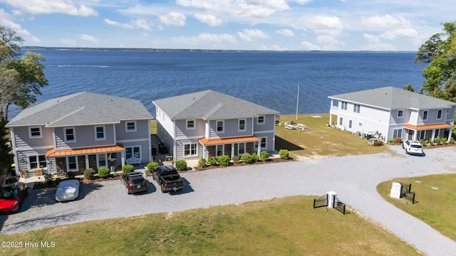 birds eye view of property with a water view